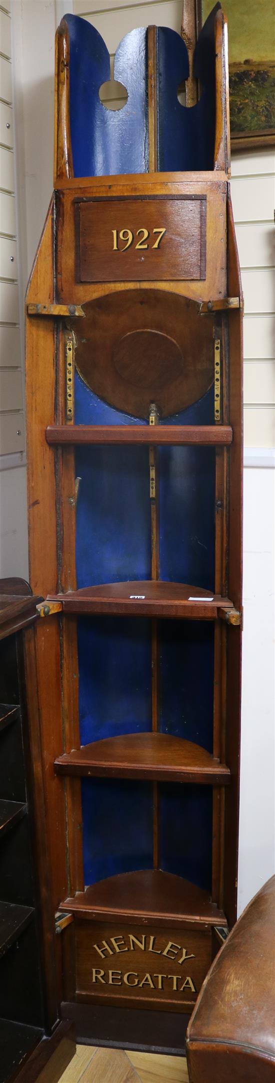 A Henley Regatta rowing boat bookcase, Toad 1927 W.54cm